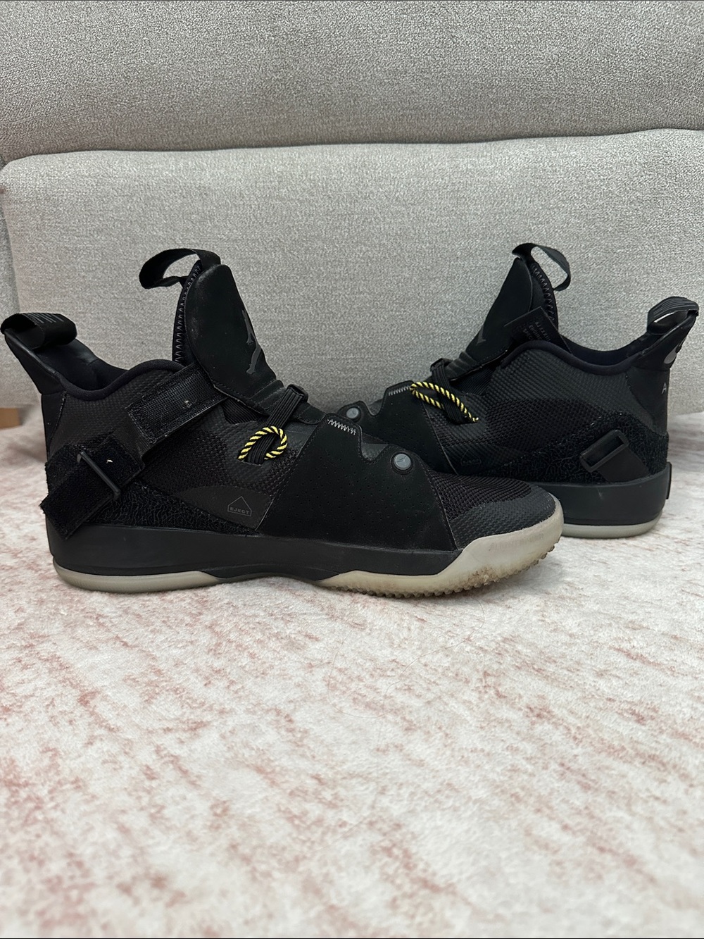 Jordan Men's Black High-Top Sneakers with Yellow Accent